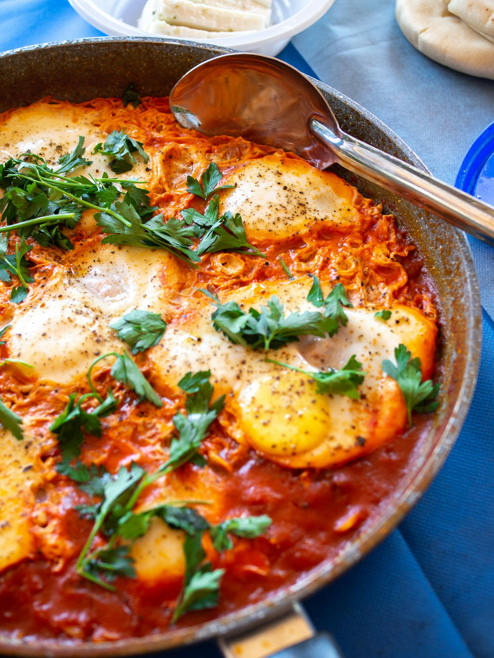 Shakshuka eggs cooked in a tomato and pepper sauce