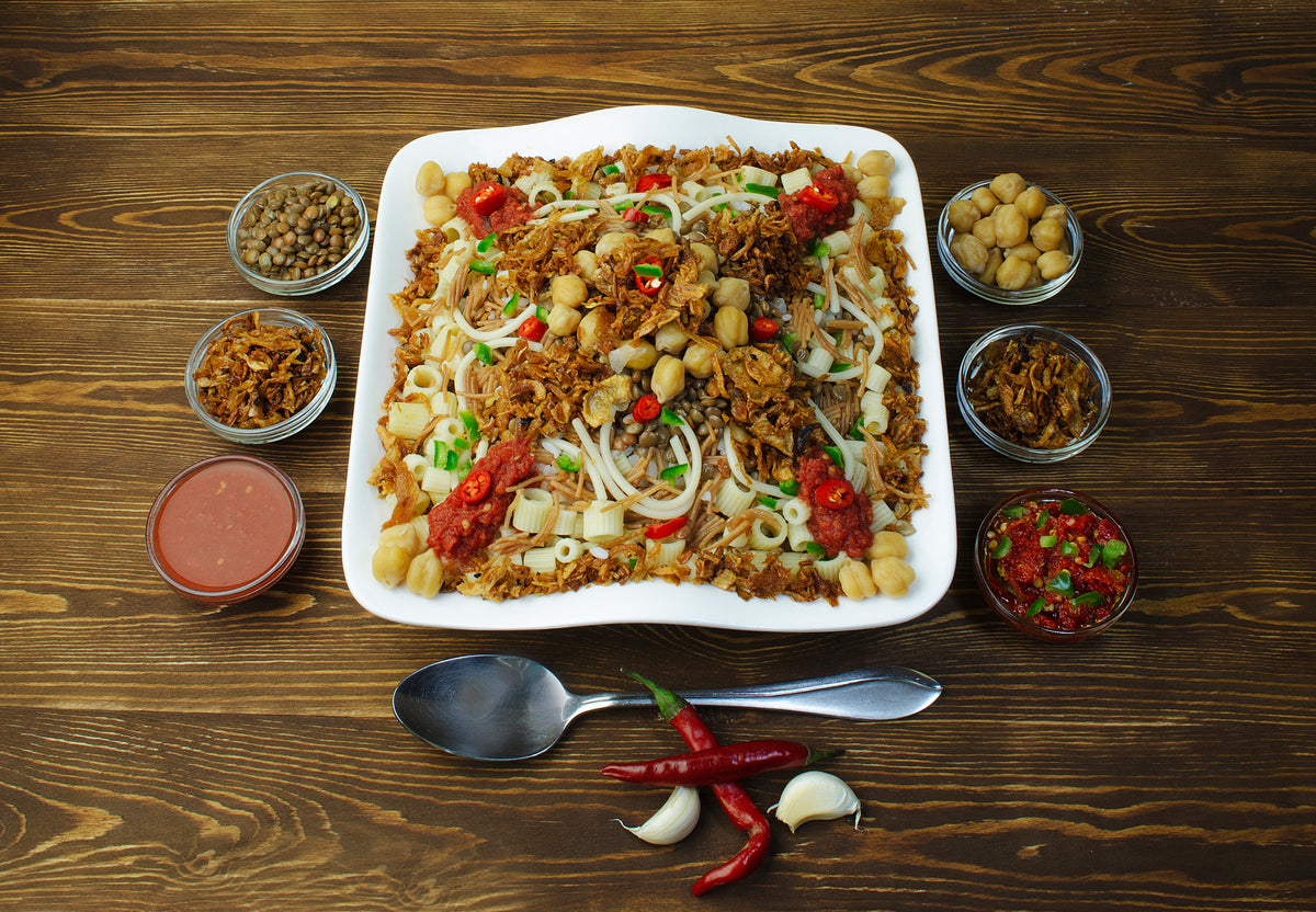 Authentic Egyptian koshari with rice, lentils, pasta, chickpeas, tomato sauce and crispy onions. Photo: Dina Said, Wikimedia Commons, CC BY-SA 4.0.