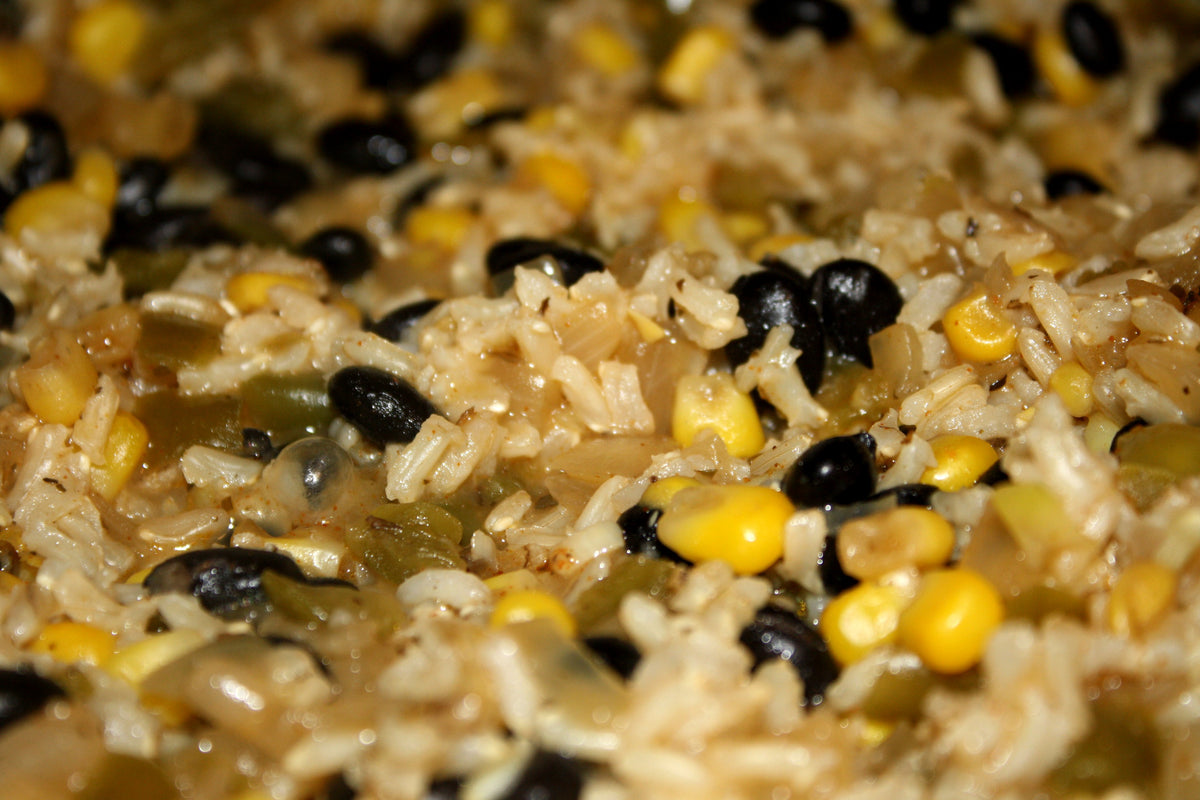 Black beans and rice with corn and green chili peppers, used as the featured photo for black bean and corn rice bowls