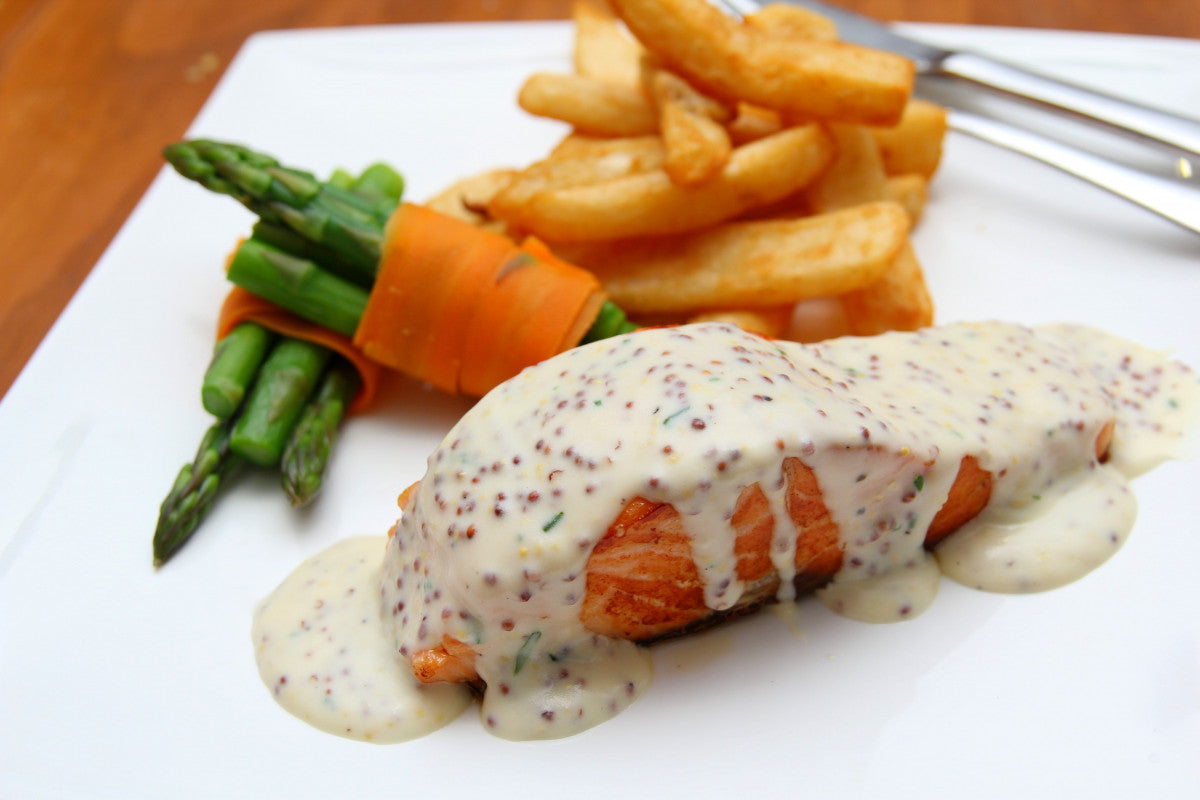 Honey mustard glazed salmon served with a fresh warm grain salad
