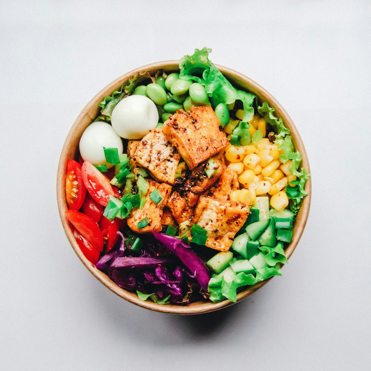 Tofu rice bowl with vegetables and sauce